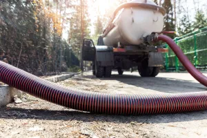 A hose connected to a septic truck